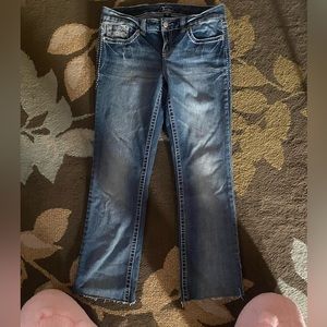 A medium washed color pair of jeans. Size 13 but fits a bit more like a size 12.